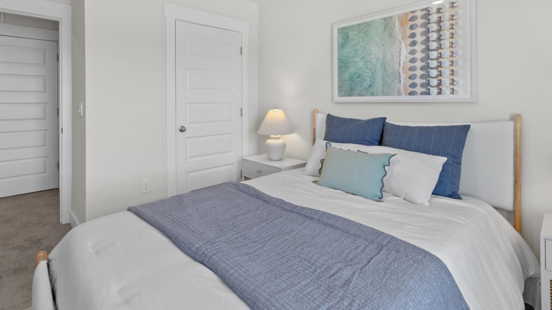 . It also includes two additional bedrooms, a shared bathroom, and a laundry room for convenience. The bathrooms are equally elegant, featuring matching granite and a primary suite with a glass shower that feels like your own personal spa.