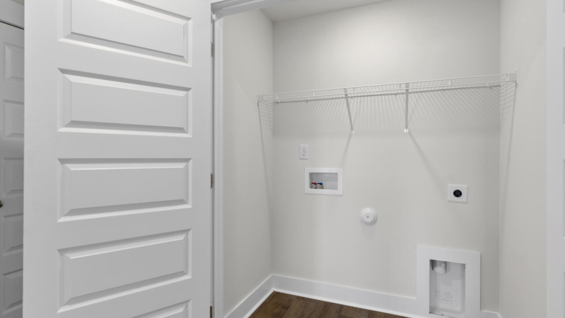 . It also includes two additional bedrooms, a shared bathroom, and a laundry room for convenience. The bathrooms are equally elegant, featuring matching granite and a primary suite with a glass shower that feels like your own personal spa.