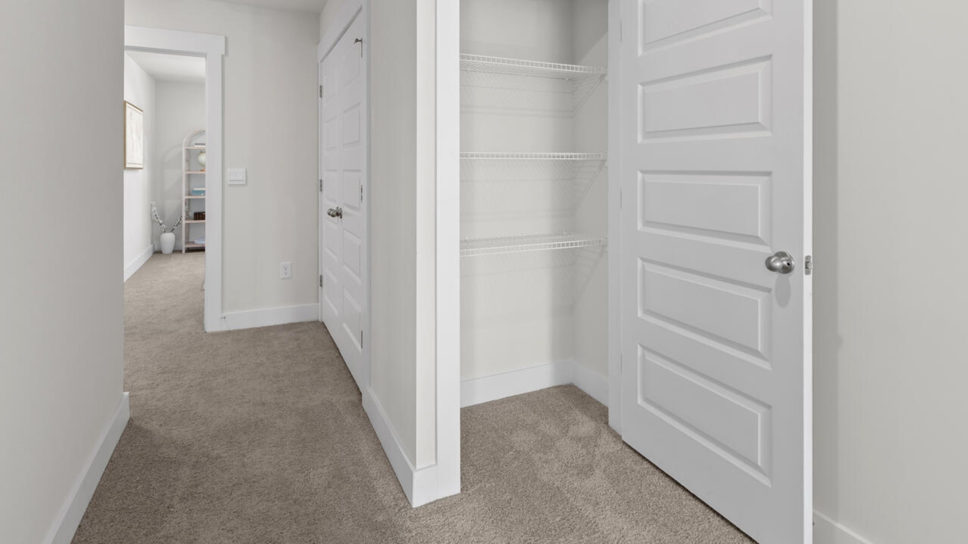 he second floor features the primary bedroom with a walk-in closet and double vanities.