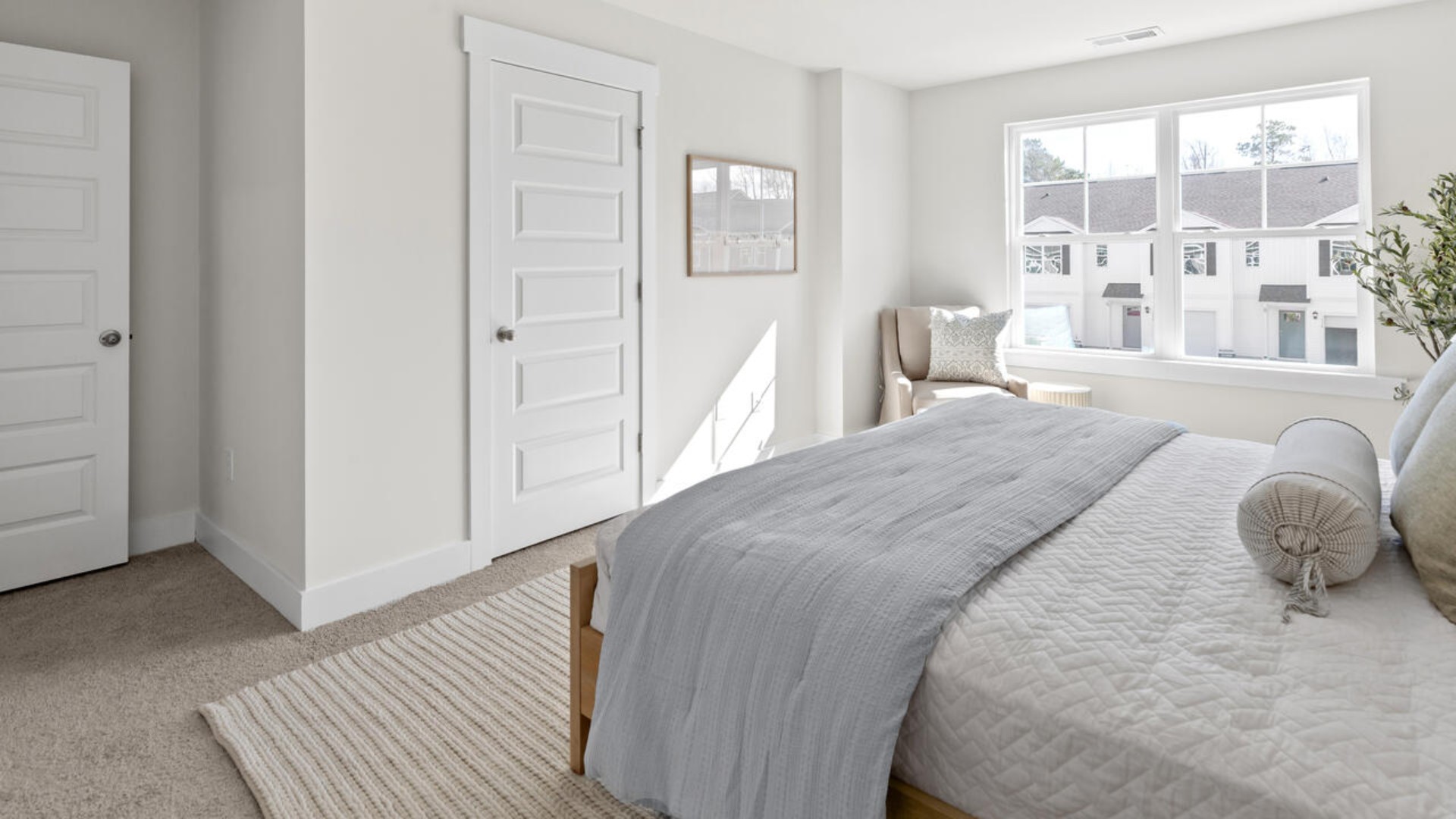 he second floor features the primary bedroom with a walk-in closet and double vanities.