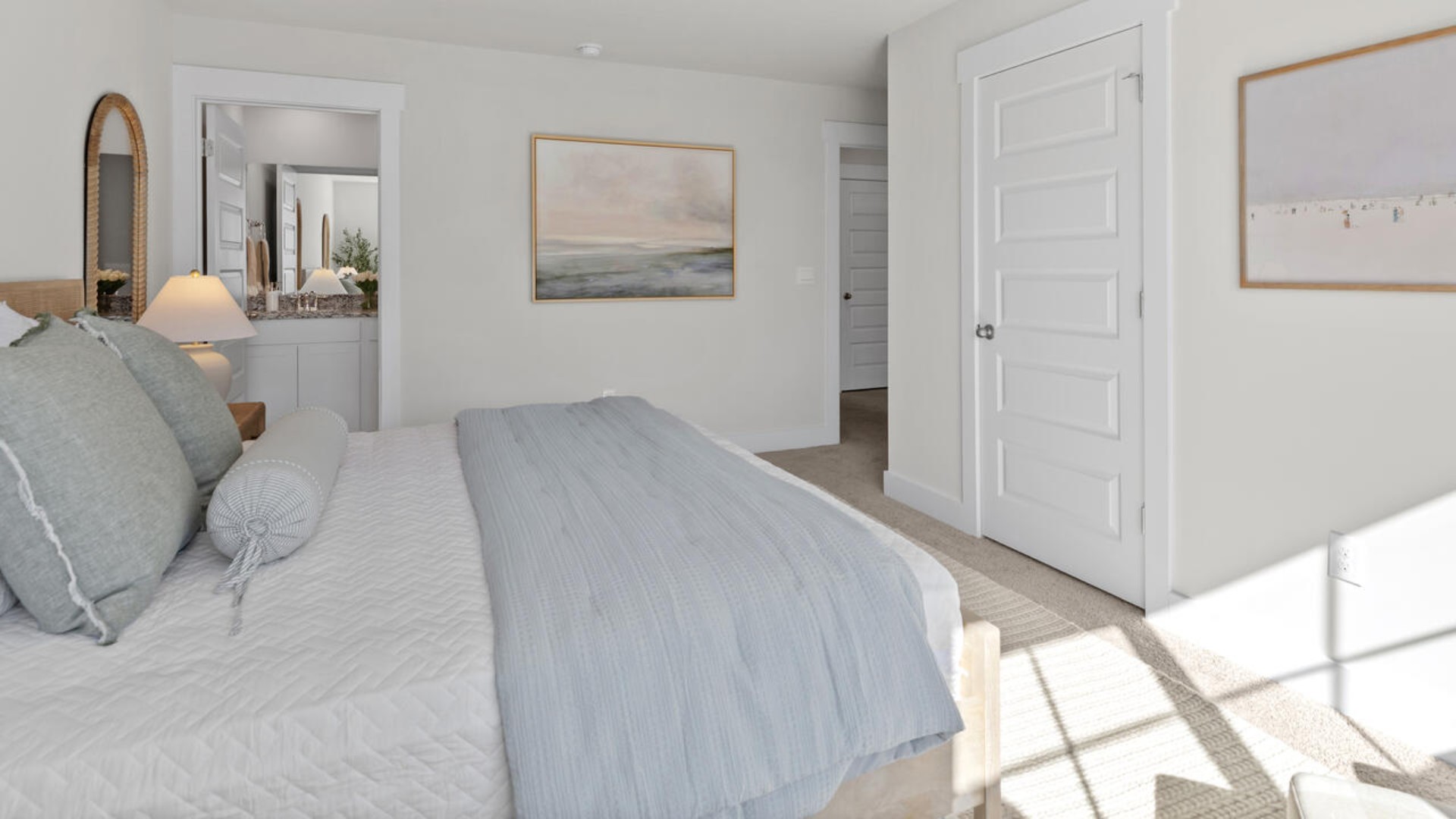 he second floor features the primary bedroom with a walk-in closet and double vanities.