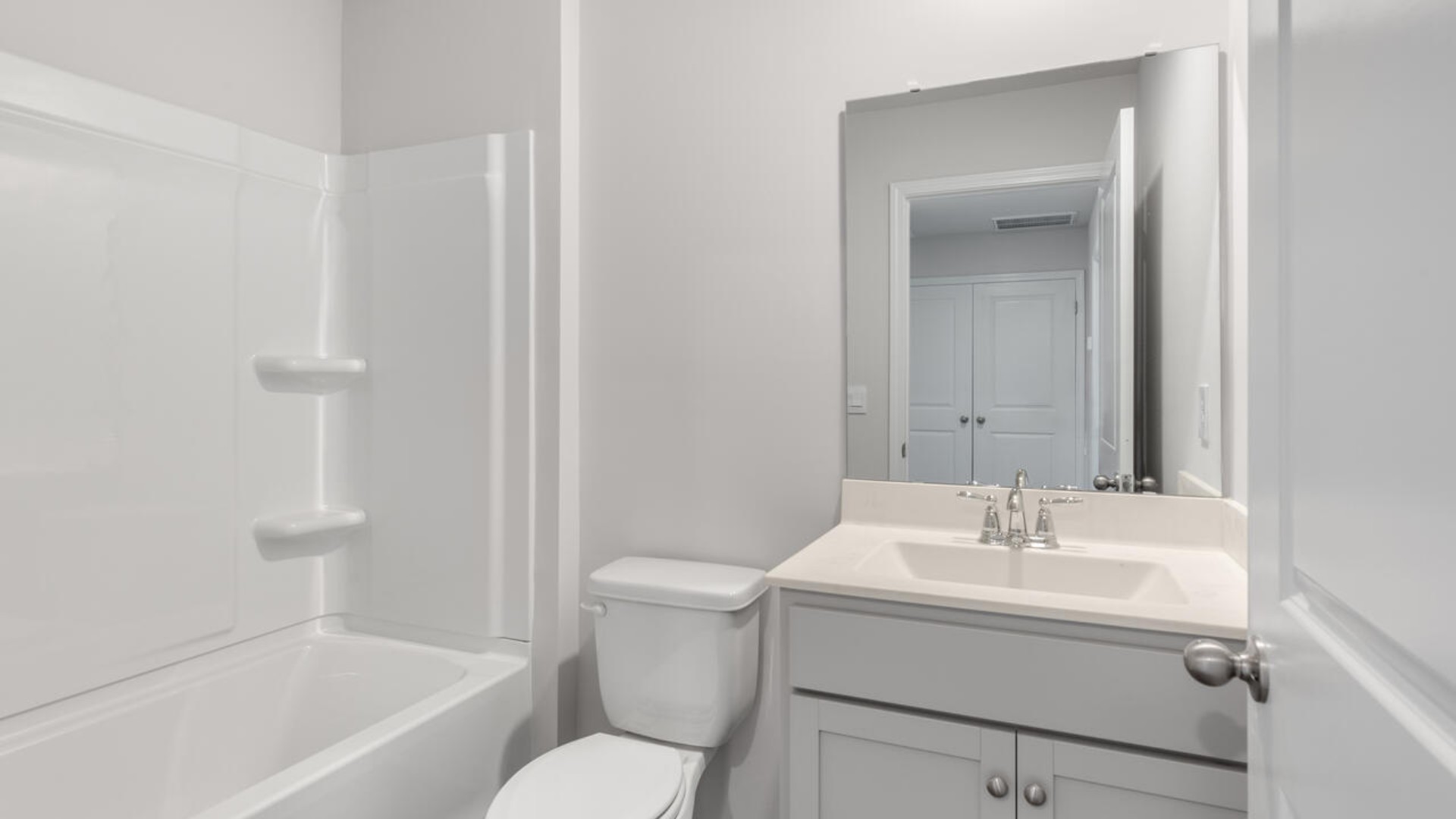 The second floor features the primary bedroom with a walk-in closet and double vanities. It also includes two additional bedrooms, a shared bathroom, and a laundry room for convenience. In every bedroom you’ll have carpeted floors