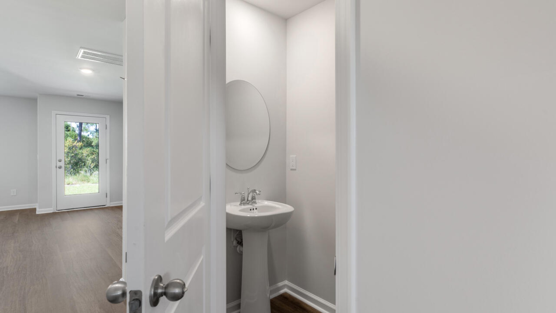 The second floor features the primary bedroom with a walk-in closet and double vanities.