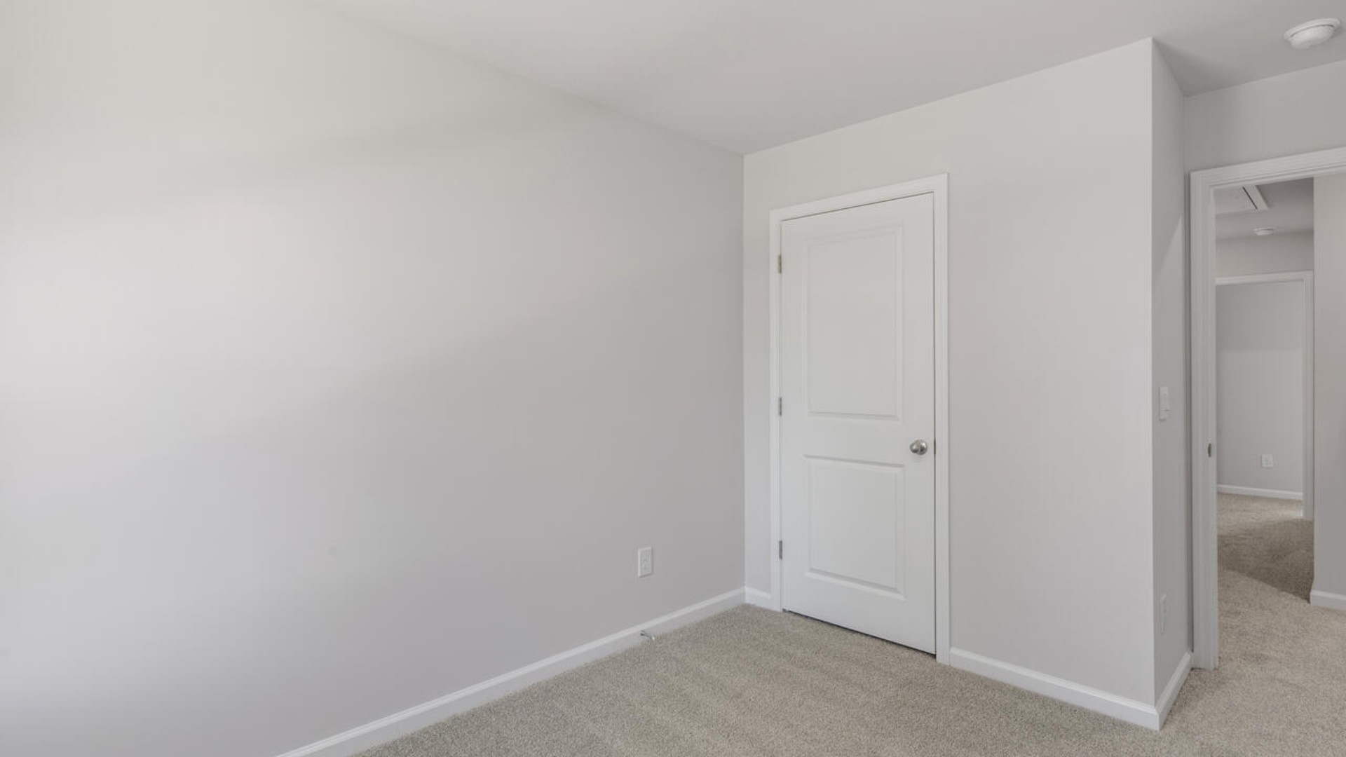 It also includes two additional bedrooms, a shared bathroom, and a laundry room for convenience.