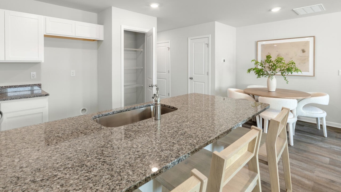 Your new Pearson features an open concept first floor anchored by a spacious kitchen with granite countertops, stainless steel appliances and a peninsula bar that overlooks your family and dining room. Ideal for entertaining guests or enjoying family time while preparing meals.