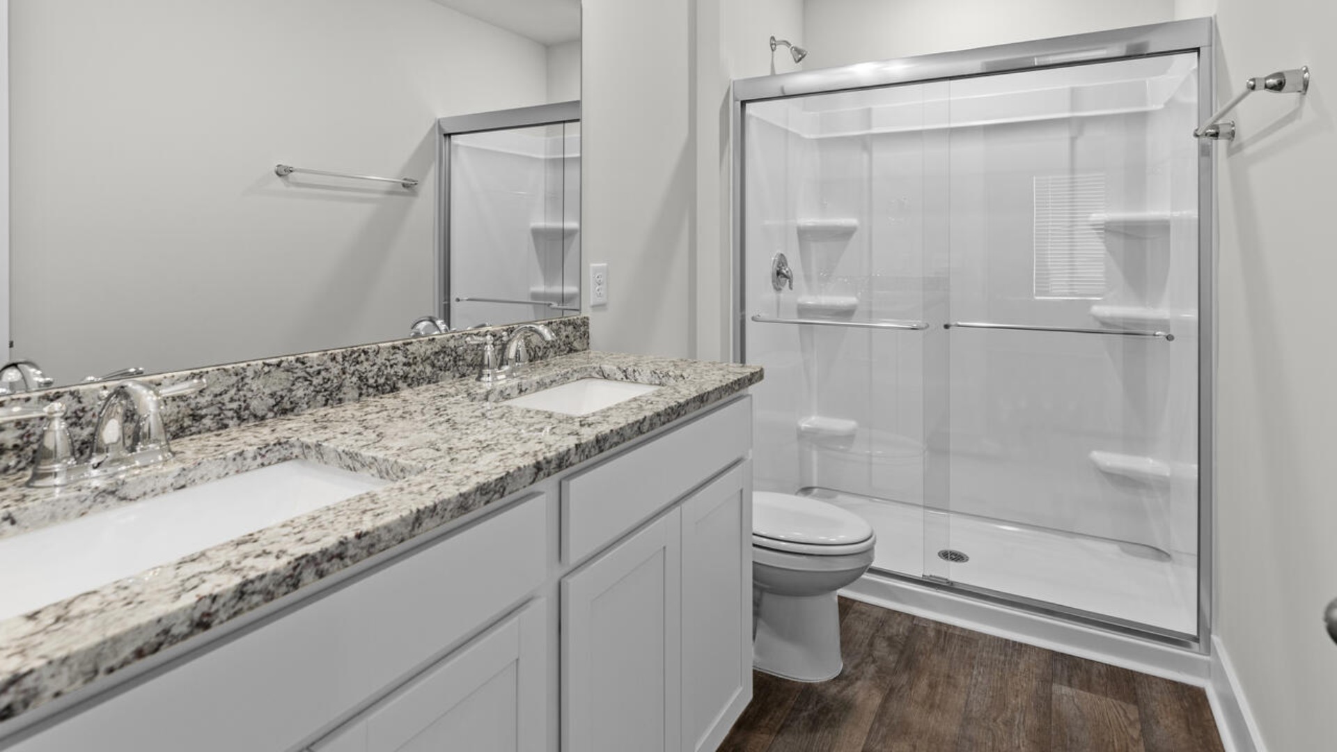 The primary bedroom is located on the first floor and has its own attached bathroom that features a walk-in closet and all the space you need to get ready in the morning