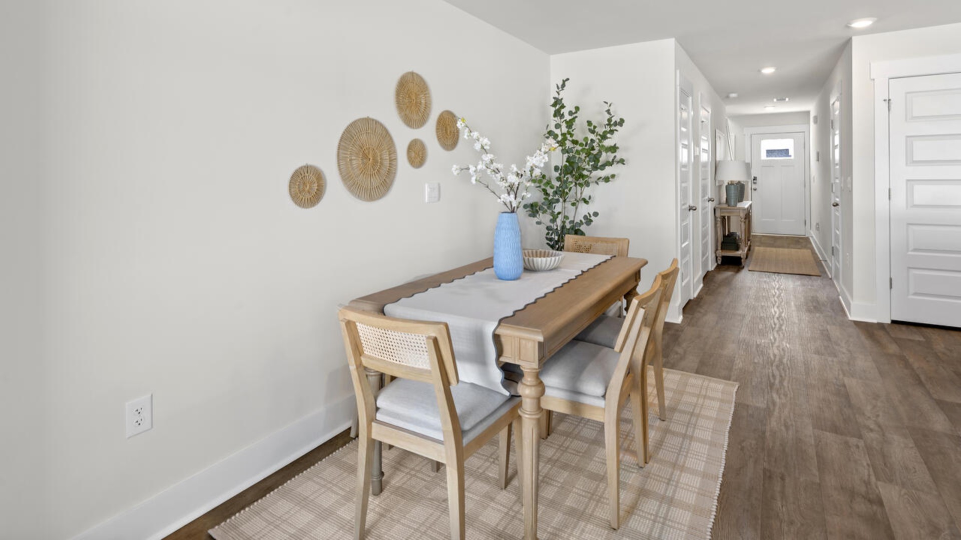 On the first floor, you'll find a spacious kitchen that flows into a light-filled living area, perfect for hosting guests. The kitchen overlooks the dining and living spaces, ideal for entertaining guests or enjoying family time while preparing meals with new stainless-steel appliances and granite countertops. You’ll never be too far from the action with the living and dining area right there.