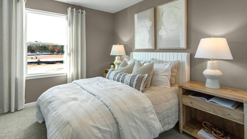 It also includes two additional bedrooms, a shared bathroom, and a laundry room for convenience.