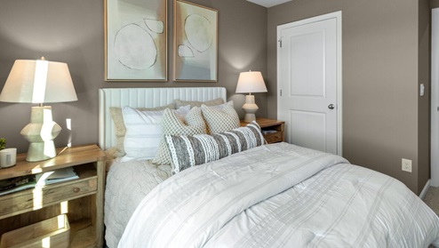 It also includes two additional bedrooms, a shared bathroom, and a laundry room for convenience.