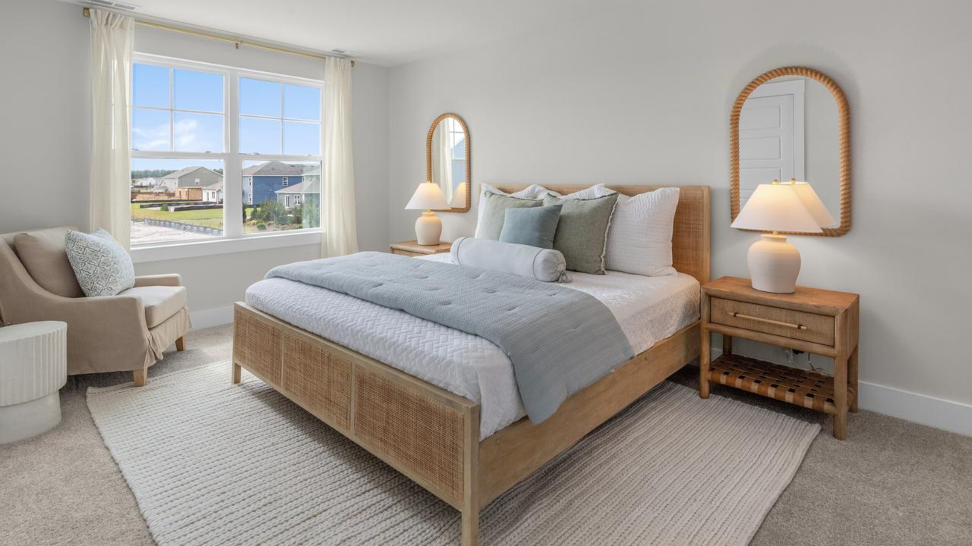 The second floor features the primary bedroom with a walk-in closet and double vanities. It also includes two additional bedrooms, a shared bathroom, and a laundry room for convenience.