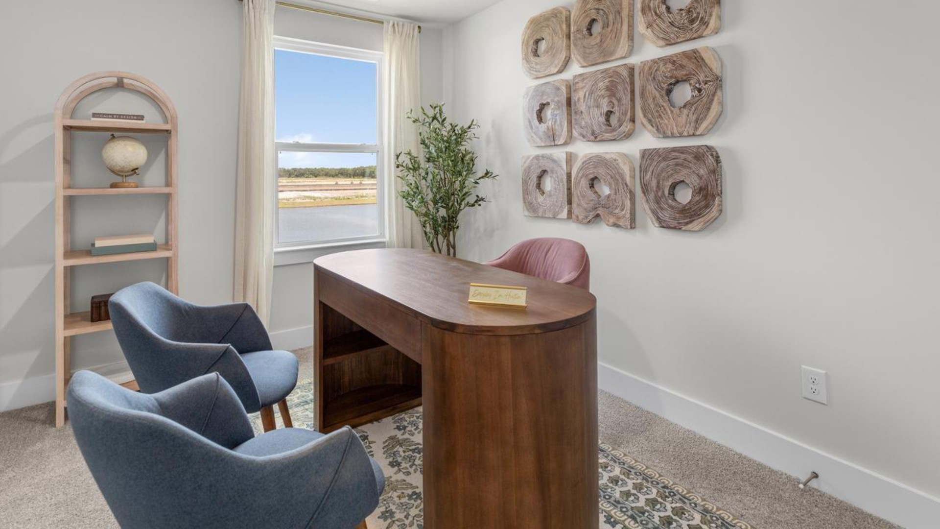 The second floor features the primary bedroom with a walk-in closet and double vanities. It also includes two additional bedrooms, a shared bathroom, and a laundry room for convenience.