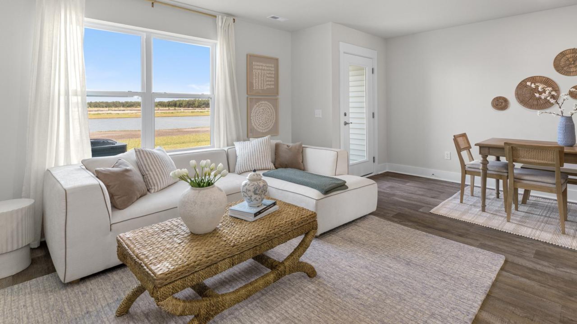 The second floor features the primary bedroom with a walk-in closet and double vanities. It also includes two additional bedrooms, a shared bathroom, and a laundry room for convenience.