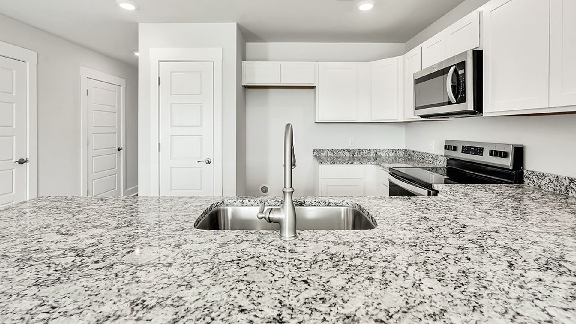 The kitchen is a showstopper with granite countertops, stainless steel appliances that are as durable as they are dazzling.