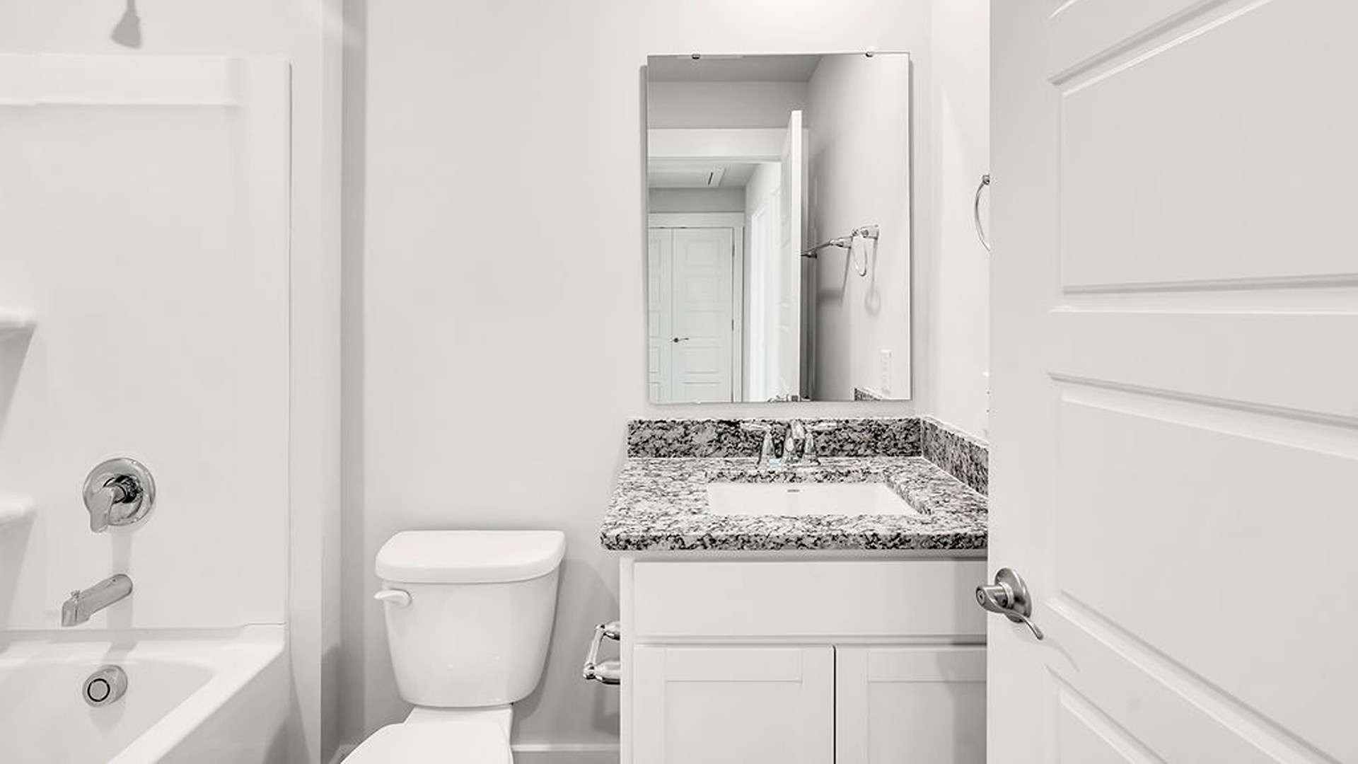 It also includes two additional bedrooms, a shared bathroom, and a laundry room for convenience.
