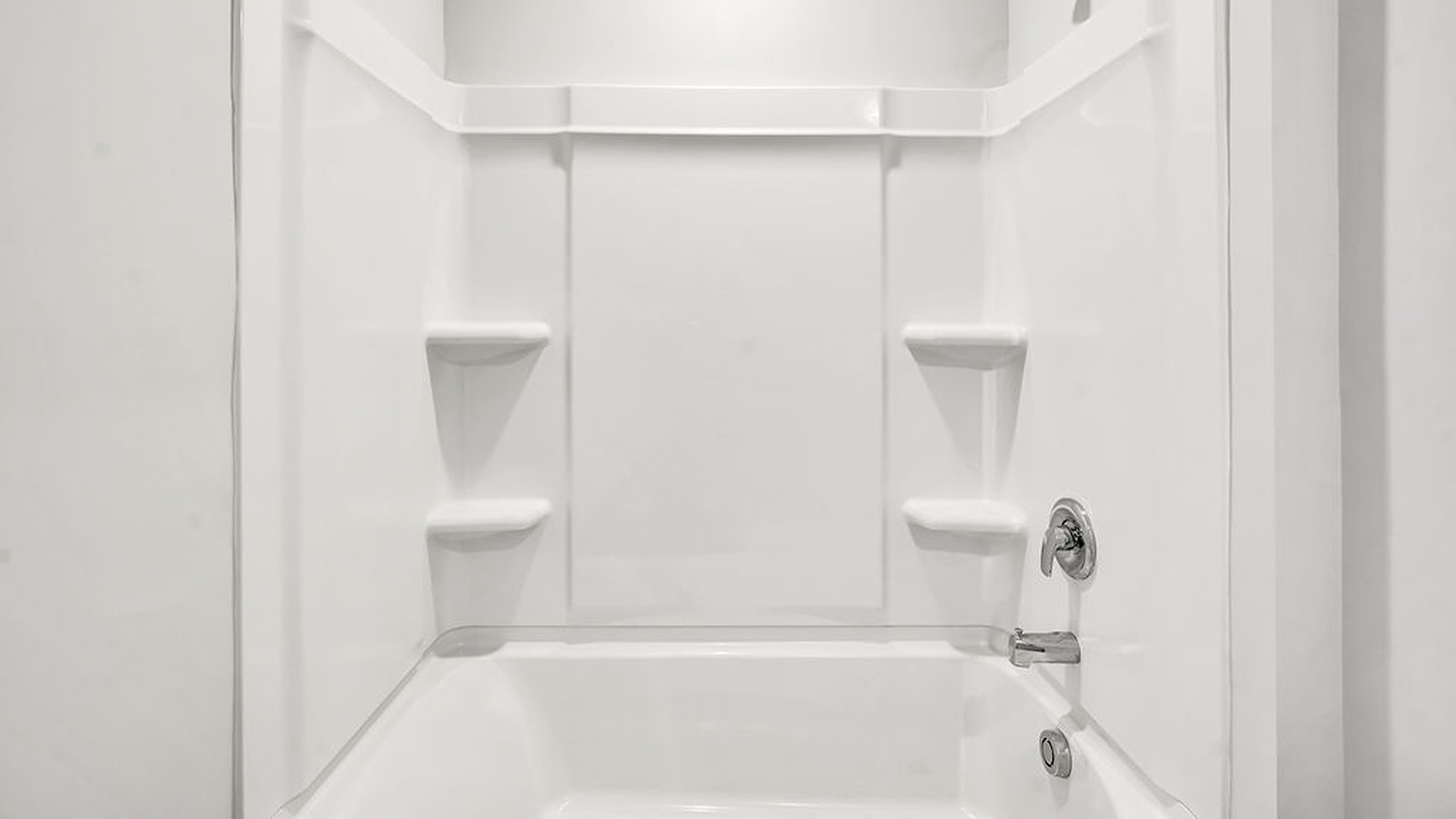 It also includes two additional bedrooms, a shared bathroom, and a laundry room for convenience.
