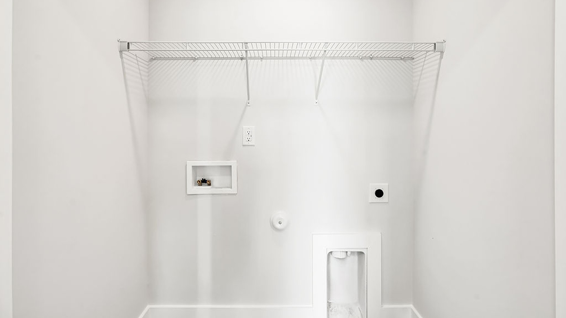 It also includes two additional bedrooms, a shared bathroom, and a laundry room for convenience.