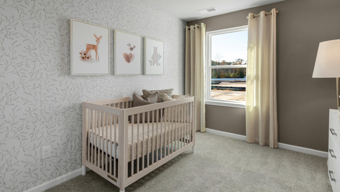 The second floor features the primary bedroom with a walk-in closet and double vanities. It also includes two additional bedrooms, a shared bathroom, and a laundry room for convenience.