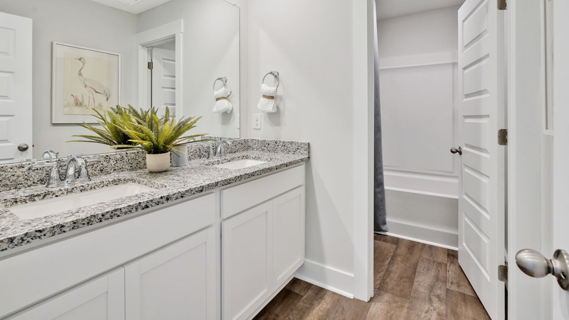 The primary bedroom has its own attached bathroom that features a walk-in closet and all the space you need to get ready in the morning. Sharing a sink isn’t a worry with the double vanity, and you also get additional privacy with a separate door for the toilet and shower.