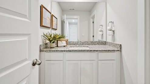The primary bedroom has its own attached bathroom that features a walk-in closet and all the space you need to get ready in the morning. Sharing a sink isn’t a worry with the double vanity, and you also get additional privacy with a separate door for the toilet and shower.