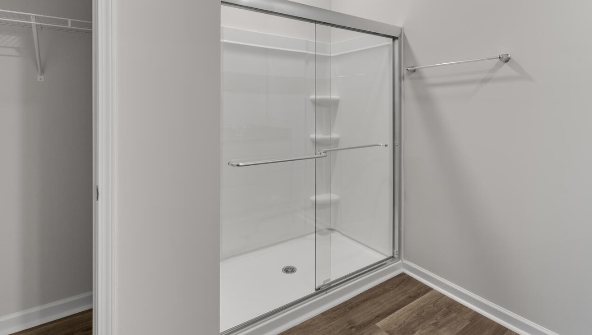 The Primary Suite offers a massive closet and a luxurious bathroom with a walk-in shower, linen closet, and dual vanity.