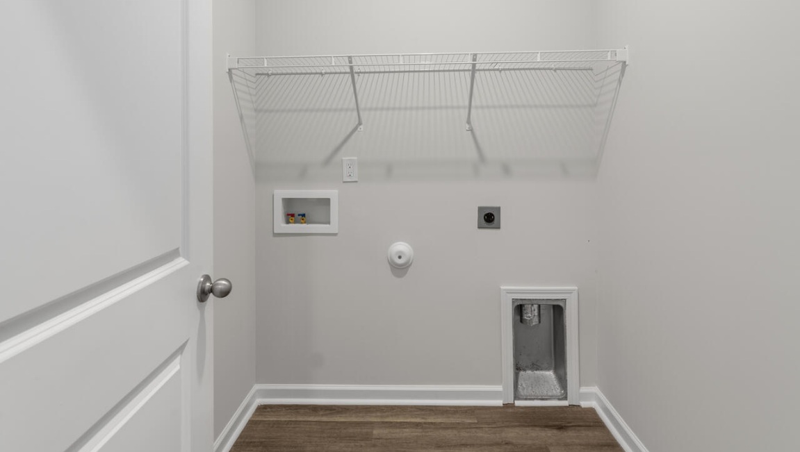 The Primary Suite offers a massive closet and a luxurious bathroom with a walk-in shower, linen closet, and dual vanity.