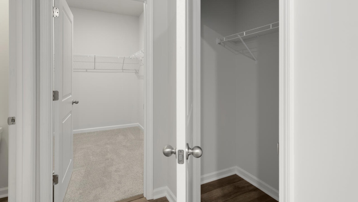 The primary bedroom has its own attached bathroom that features a walk-in closet and all the space you need to get ready in the morning