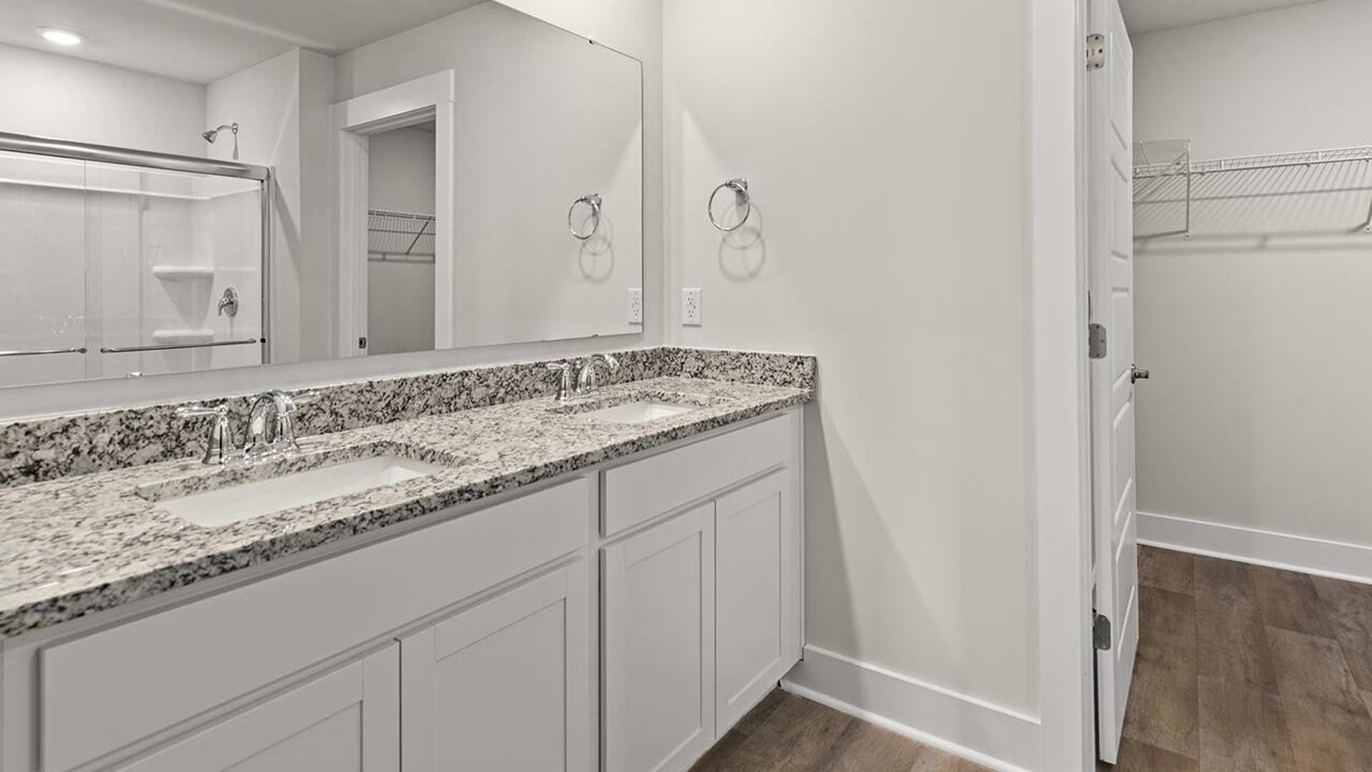 On the first floor is the primary bedroom has its own attached bathroom that features a walk-in closet and all the space you need to get ready in the morning.