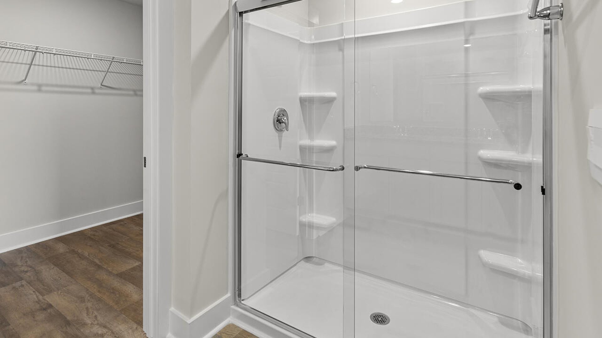 On the first floor is the primary bedroom has its own attached bathroom that features a walk-in closet and all the space you need to get ready in the morning.