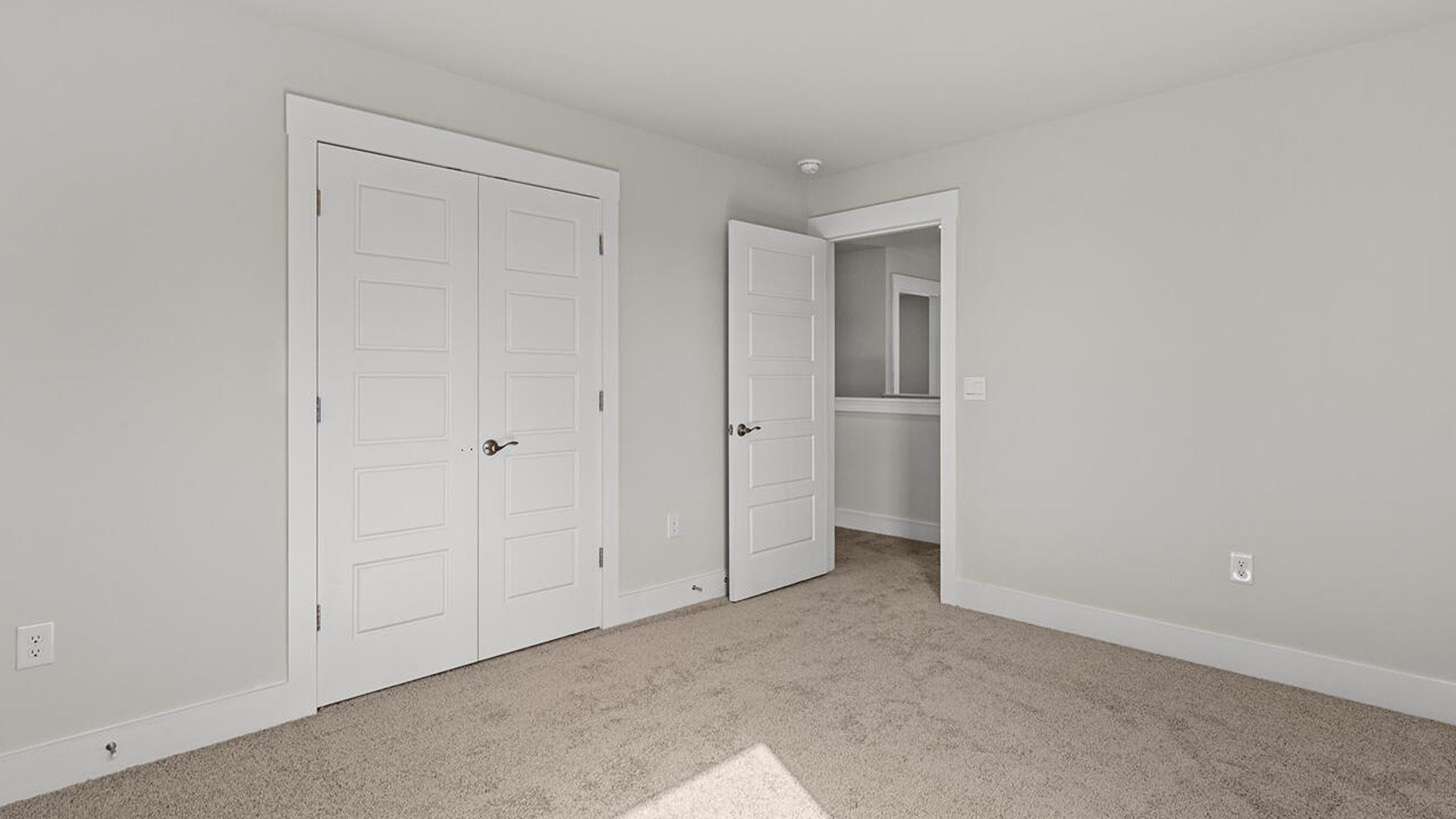 Upstairs, you will find three additional bedrooms with a shared full bathroom and a functional living space.