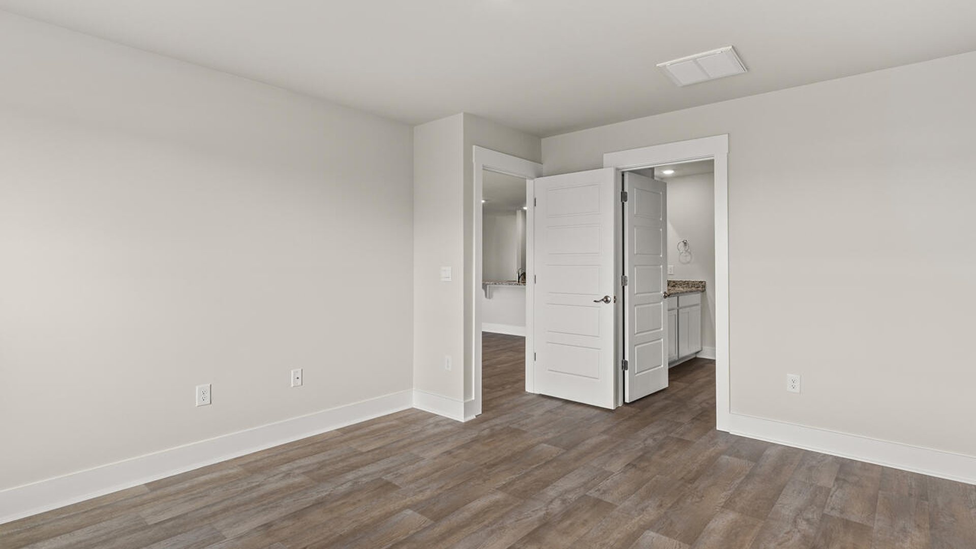 On the first floor is the primary bedroom has its own attached bathroom that features a walk-in closet and all the space you need to get ready in the morning.