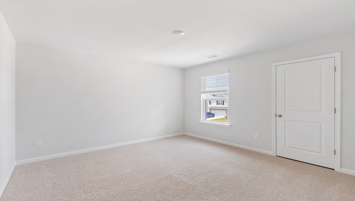 Upstairs, you will find three additional bedrooms with a shared full bathroom and a functional living space. In every bedroom you’ll have carpeted floors and a closet in each room. Whether these rooms become bedrooms, office spaces, or other bonus rooms, there is sure to be comfort.