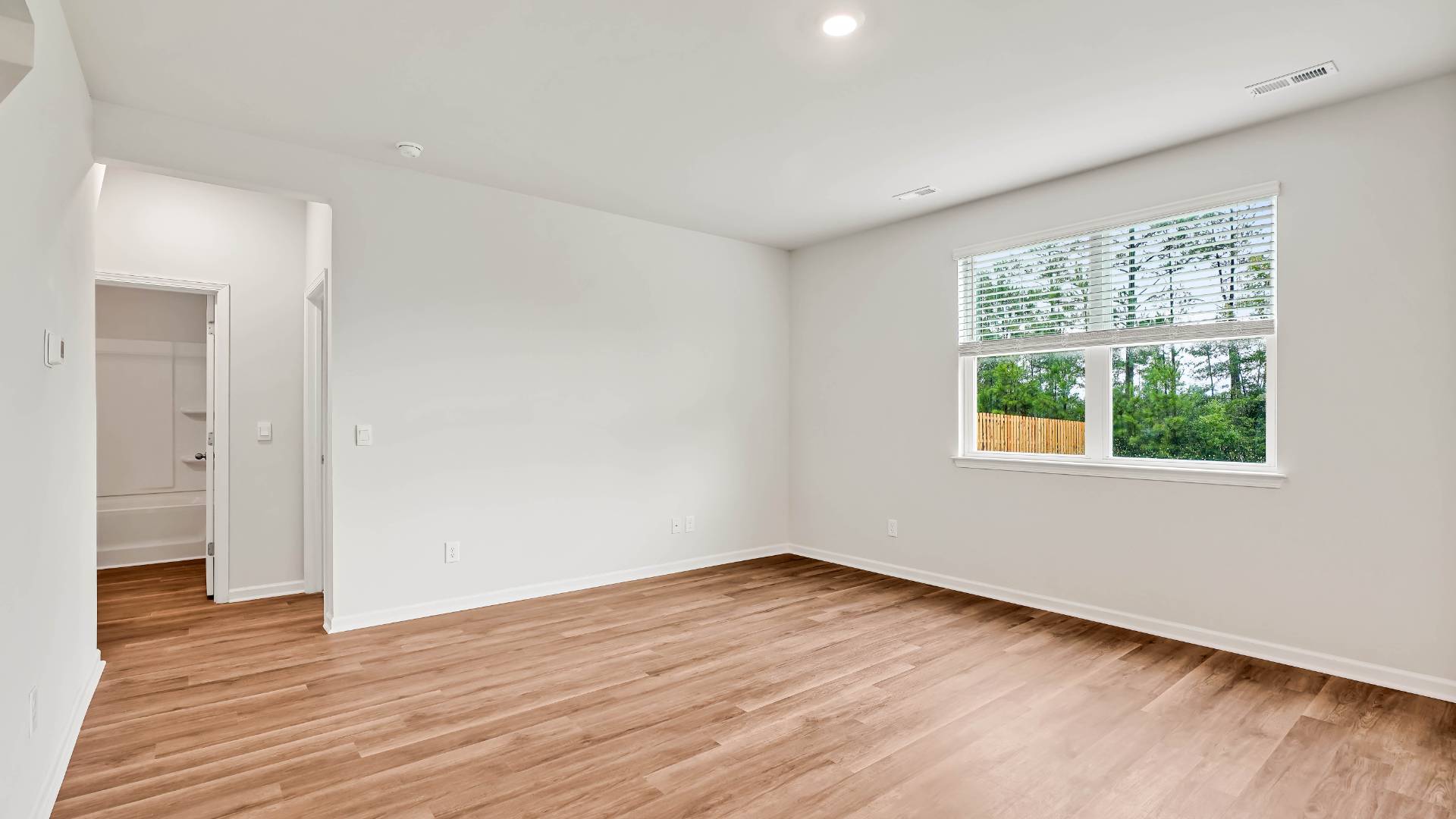 The open-concept kitchen features granite countertops and stainless steel appliances. The kitchen seamlessly connects to the dining and living areas, creating a great space for entertainment