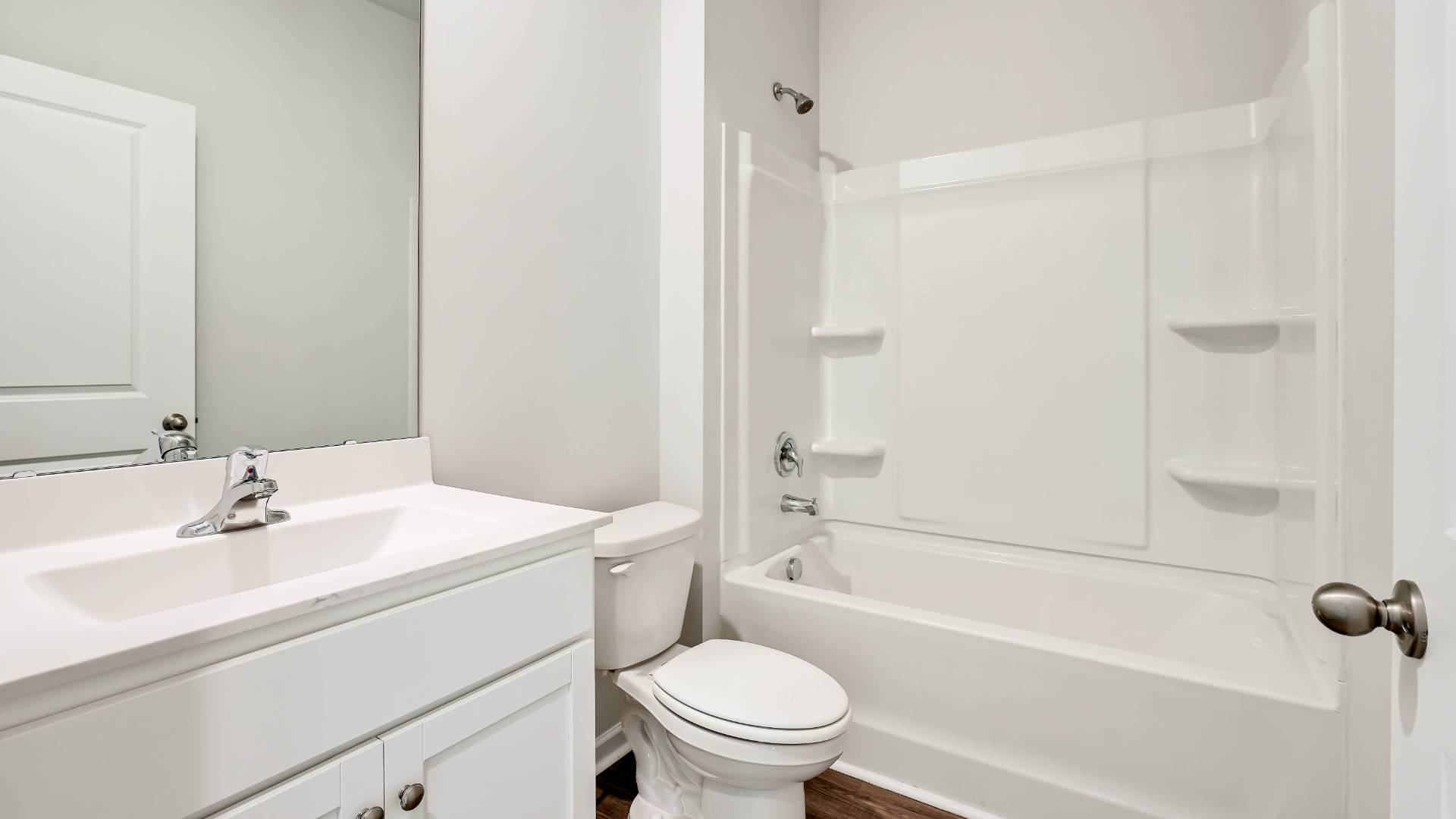 The upstairs has an additional living space, a laundry room, and a Primary Bedroom.