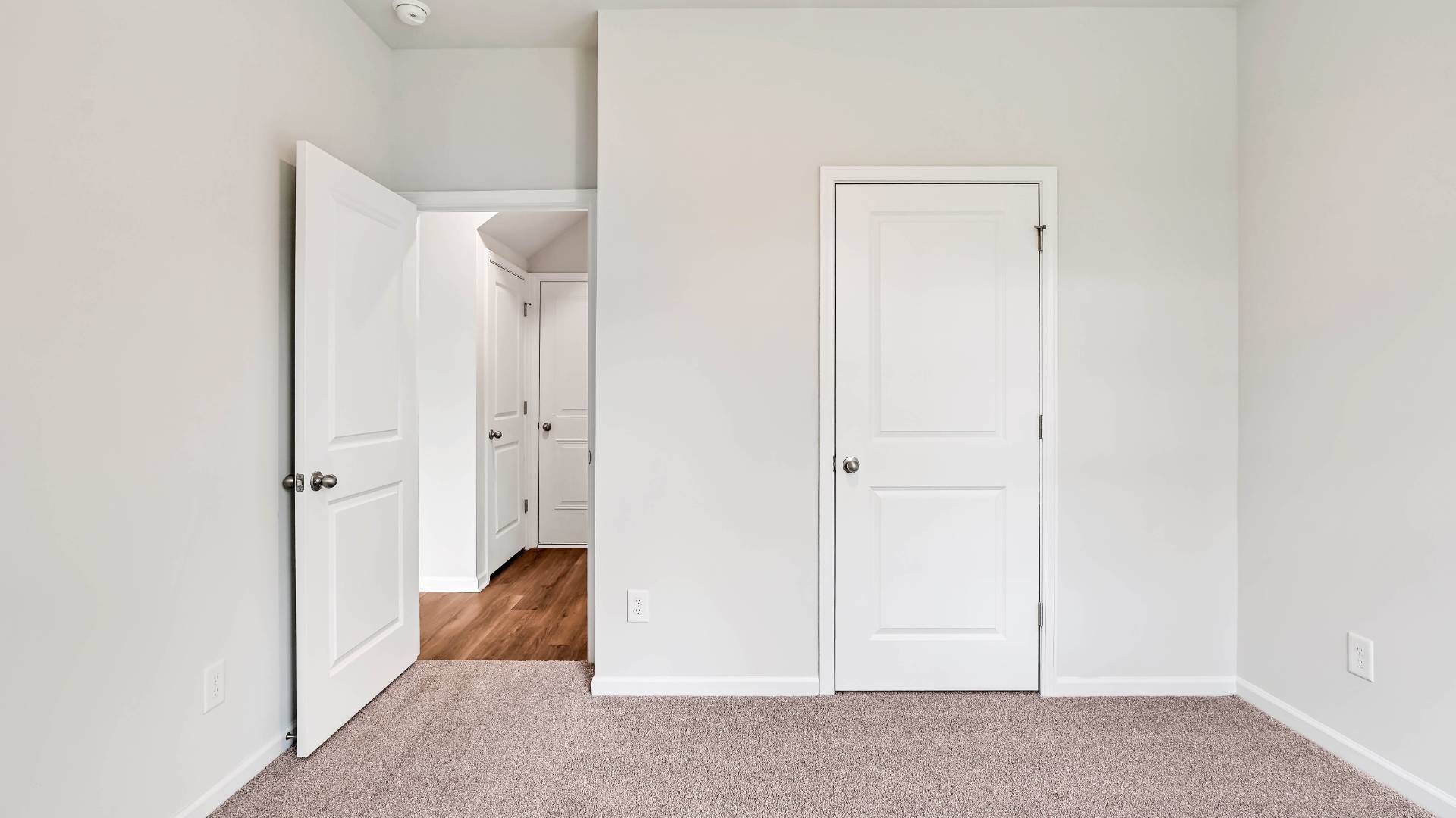 The upstairs has an additional living space, a laundry room, and a Primary Bedroom.