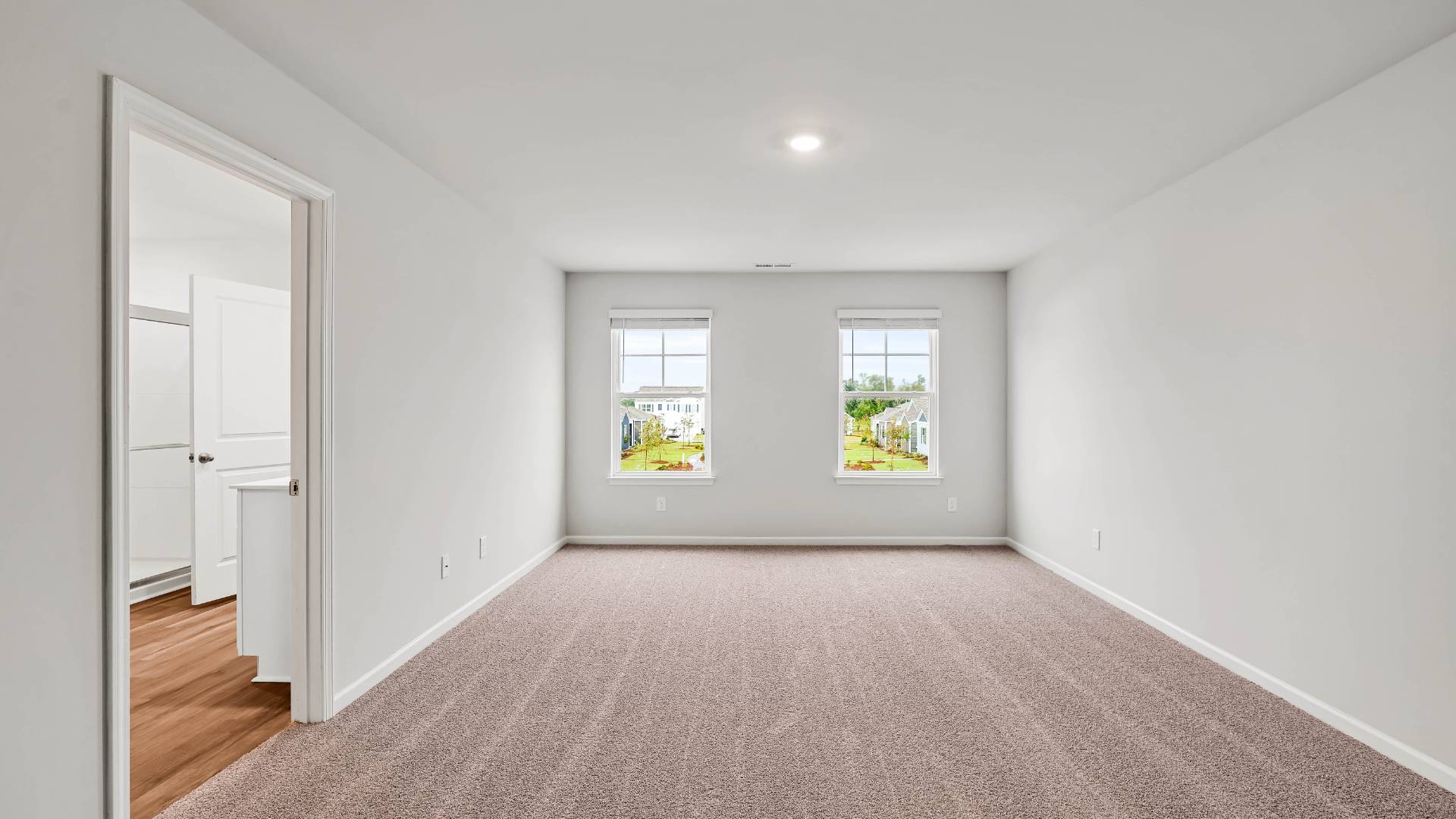 The upstairs has an additional living space, a laundry room, and a Primary Bedroom.