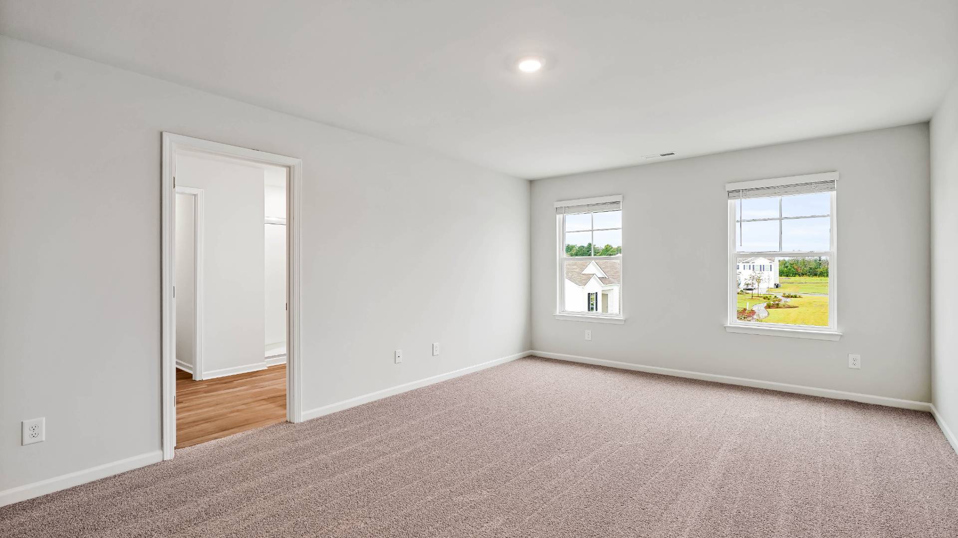 The upstairs has an additional living space, a laundry room, and a Primary Bedroom.