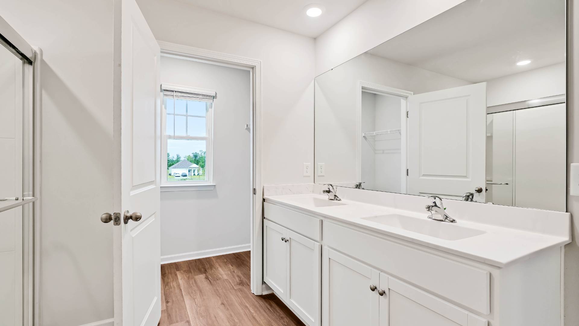 The upstairs has an additional living space, a laundry room, and a Primary Bedroom.