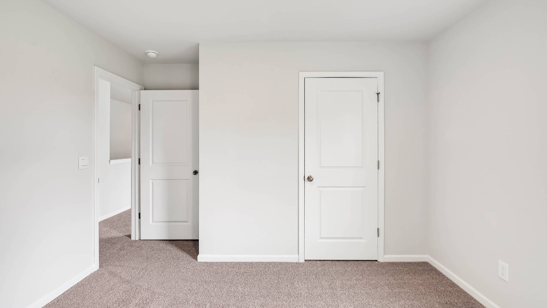 The upstairs has an additional living space, a laundry room, and a Primary Bedroom.