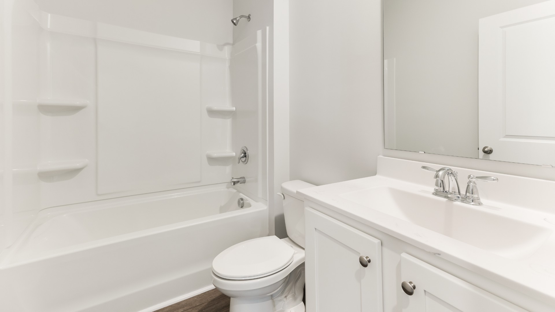 The open-concept kitchen features granite countertops and stainless steel appliances. The kitchen seamlessly connects to the dining and living areas, creating a great space for entertainment.