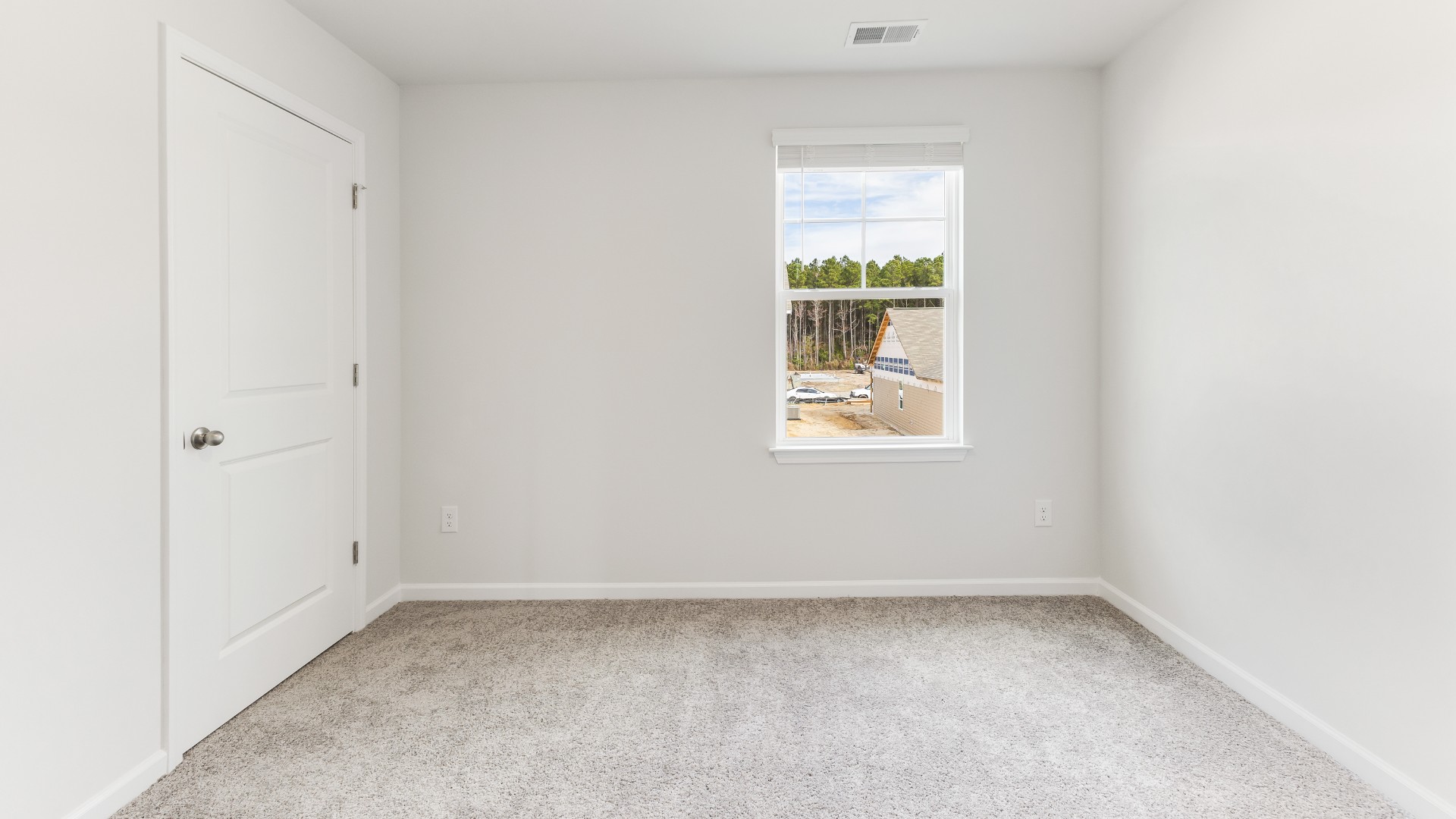 The open-concept kitchen features granite countertops and stainless steel appliances. The kitchen seamlessly connects to the dining and living areas, creating a great space for entertainment.