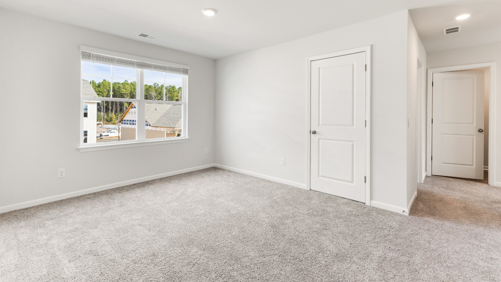 The upstairs has an additional living space, a laundry room, and a Primary Bedroom. Downstairs, a flex room can be used as an office or sitting area. In every bedroom you’ll have carpeted floors and a closet in each room. Whether these rooms become bedrooms, office spaces, or other bonus rooms, there is sure to be comfort.