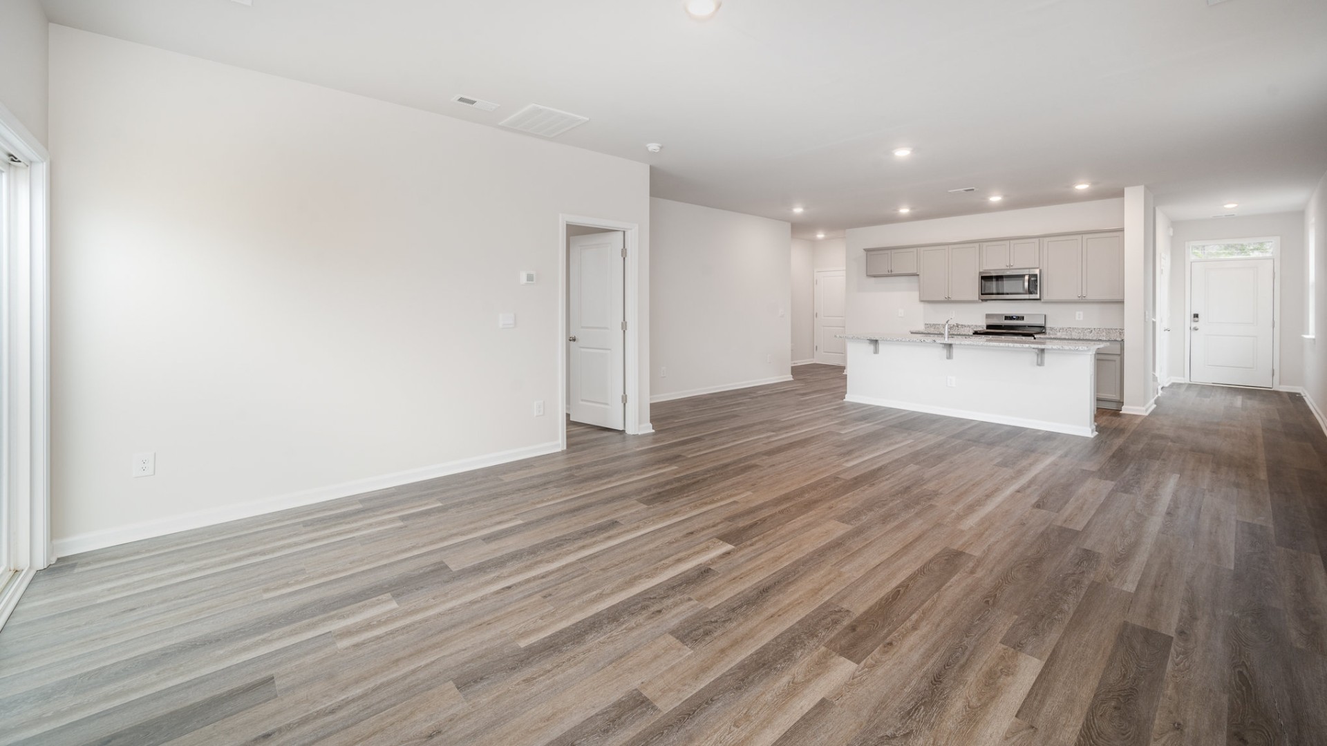 The living area is an open concept, where your kitchen, living, and dining areas blend seamlessly into a space perfect for everyday living and entertaining.