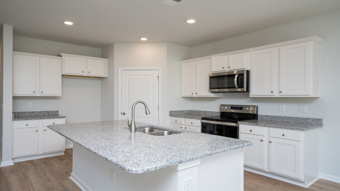 The Elle is a 2,721 sq ft home featuring 5 Bedrooms and 3.5 Baths. Its open-concept design includes a kitchen with Granite countertops, Stainless Steel Appliances, an island, and a walk-in pantry, while the large Great Room is ideal for entertaining.