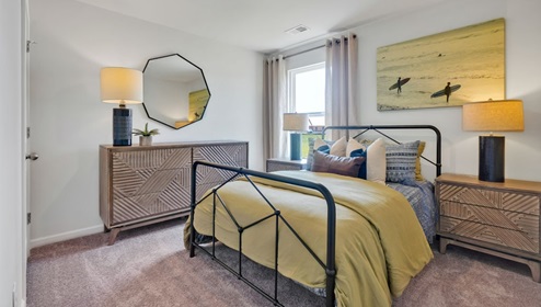 As you enter, you'll find three bedrooms with a shared bathroom, while the Primary Bedroom, off the living area, offers a private ensuite bathroom. This home combines a functional layout with quality finishes, making it a great choice for those seeking a modern ranch-style design.