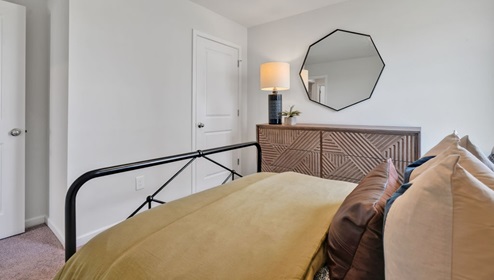 As you enter, you'll find three bedrooms with a shared bathroom, while the Primary Bedroom, off the living area, offers a private ensuite bathroom. This home combines a functional layout with quality finishes, making it a great choice for those seeking a modern ranch-style design.