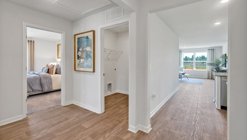 As you enter, you'll find three bedrooms with a shared bathroom, while the Primary Bedroom, off the living area, offers a private ensuite bathroom. This home combines a functional layout with quality finishes, making it a great choice for those seeking a modern ranch-style design.