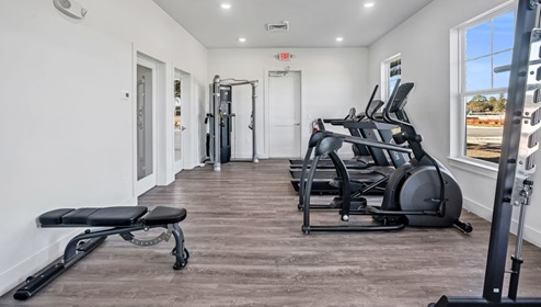Clubhouse with dining room, kitchen, living room. Open area. Television.