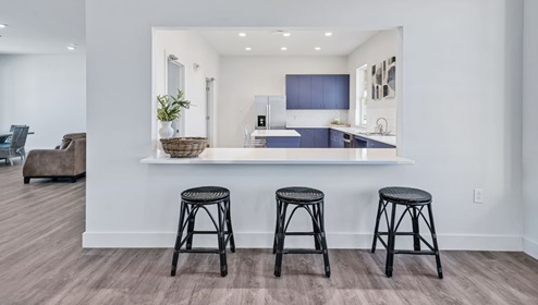 Clubhouse with dining room, kitchen, living room. Open area. Television.