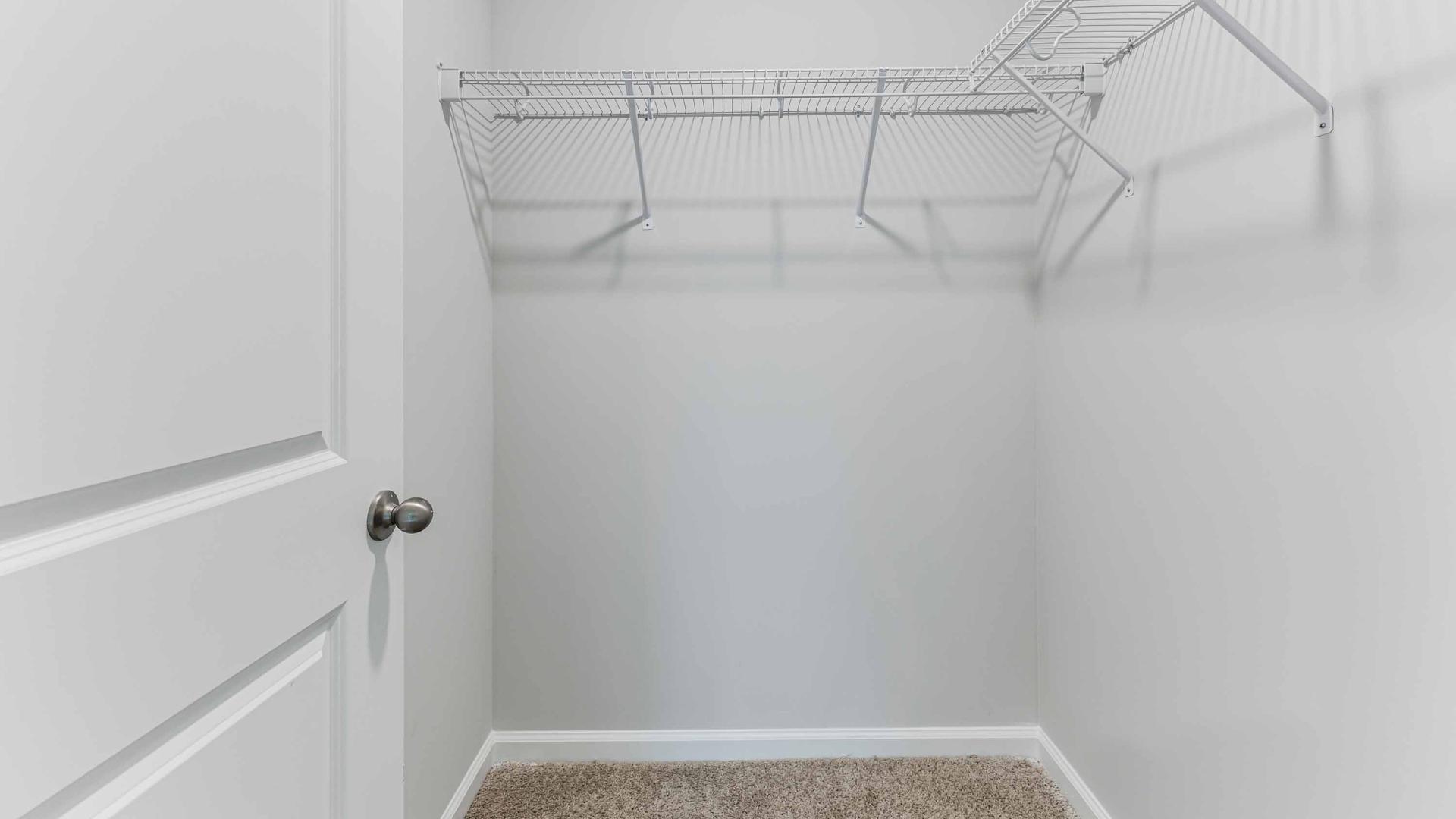 The two bathrooms feature granite countertops. The primary suite has a spacious bedroom with a walk in closet, and the bath has a walk in shower. Architectural shingles, garage door opener, and screens on all windows!