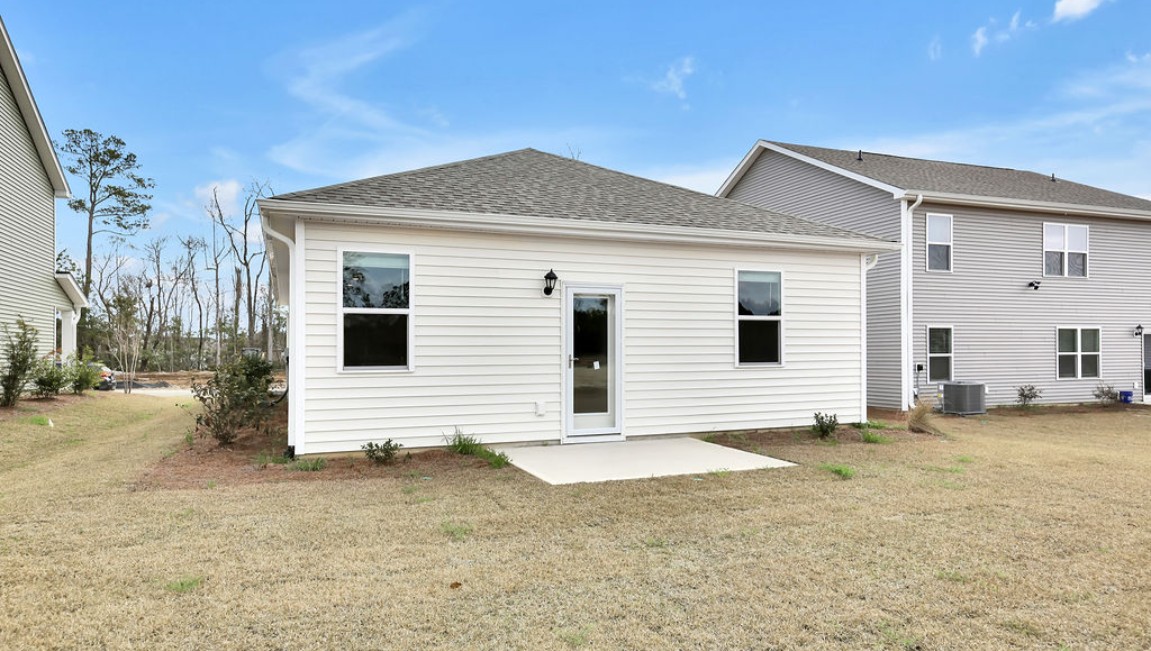 The Curtis is a three-bedroom, two-bathroom floor plan designed for modern living.It features an open-concept layout, where the kitchen comes with stainless steel appliances and a sleek peninsula countertop that overlooks the spacious living room, creating a great space for entertaining or relaxing. To the left of the front door, you'll find two bedrooms, a shared bathroom, and a convenient laundry room. At the back, the owner's suite offers a walk-in closet, a dual vanity, and a luxurious walk-in shower. If you're looking for a stylish and functional new home, the Curtis is a perfect choice. Enjoy the patio perfect for entertaining and enjoying the Carolina nights.